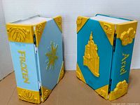 Two closed cases showing exterior colors, motifs and hinges