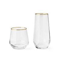 Stock image of one short and one tall gold-rim crystal glass