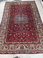 Full view of the entire rug showing field, borders and fringe