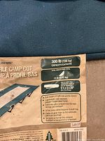 Specification label showing brand Woods, 300 lb capacity, 13 lb weight