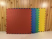 Four coloured foam panels stacked showing edge connectors