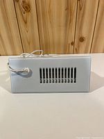 Front view of Cyclone CM-300 booster fan showing grille and logo