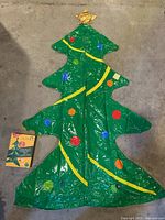 Inflatable Christmas tree laid flat showing full design and star topper