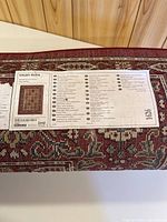 Factory label on rolled IKEA VALBY RUTA rug