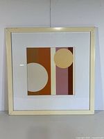 Front view of framed geometric artwork showing design and frame