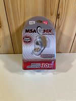Front view of sealed MSA 30X sound amplifier package