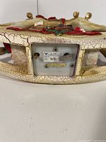 Underside showing wind-up mechanism and label