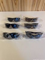 All five sealed pairs of Joe Fresh sunglasses displayed