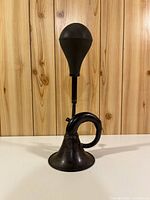 Front view of metal car horn with rubber bulb