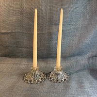 Both Boopie candleholders with taper candles inserted, full view