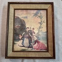 Front view of framed canvas print showing artwork, frame, and mat