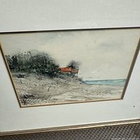 Close-up of watercolour showing beach scene and signature area