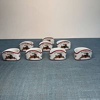 All eight Portmeirion Susan Winget reindeer napkin rings front view