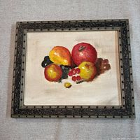 Front view of framed fruit still life painting
