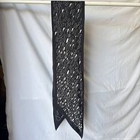 Full view of scarf hanging to show size and pattern