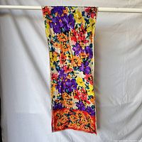 Full view of long rectangular floral silk scarf