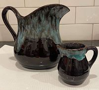 Large and small Blue Mountain Pottery vases front view