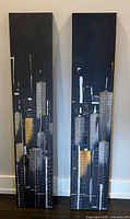 Front view of both tall cityscape canvases