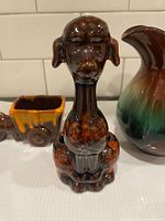 Close-up of poodle drip-glaze planter/vase