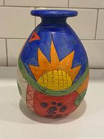 Front view showing sunburst and abstract motifs