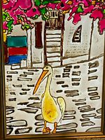 Close view of stained glass stork scene within frame