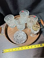 Overview of four tumblers, ashtray, lighter and tray