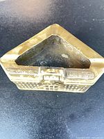 Front view showing building detail and raised text