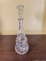 Full view of crystal decanter with stopper
