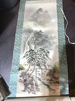 Full view of hanging scroll showing artwork, brocade border, hanging cord and bottom rod