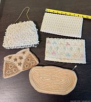 Group shot of all five clutches showing size, color and styles