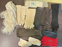 Overview of all gloves and shawl laid out on table