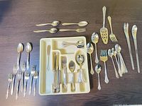 Overall lot with tray, forks, spoons, knives and serving pieces visible