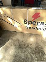 Front of sealed Sperax treadmill box with brand logo and lightning bolt graphic