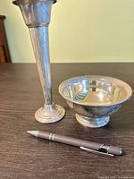 Dish and vase front view with pen for scale