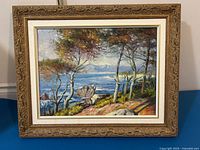 Front view of framed landscape painting