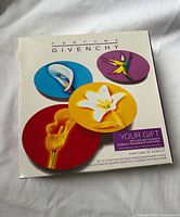 Box front showing Givenchy branding and four plate designs