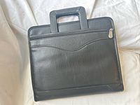 Front view of black leather briefcase binder