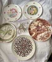 Front view of all five visible plates and bag of hangers