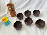 All items: six clay teacups, wooden cup, rubber ducky infuser