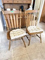 Front three-quarter view of both chairs with cushions