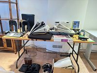 Top view of rectangular laminate folding table with items on top