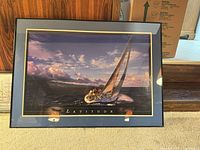 Front view showing entire framed print with sailboat image and title