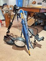 Golf pull cart, FootJoy shoes, umbrellas grouped