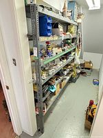 Full view of galvanized steel shelving unit in basement setting