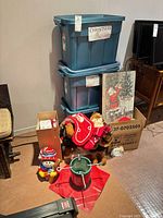 overall lot with storage totes, tree stand, plush toys, wall art
