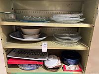 Shelved mixed lot of glass, ceramic and stoneware serveware