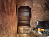 Full view of pine bookcase showing upper shelves and lower cabinet