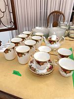 Group shot showing cups, teacups, saucers, sugar bowl, creamer
