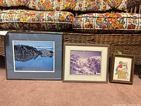 All three framed artworks side by side on floor