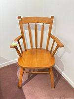 Front view of solid wood spindle-back armchair